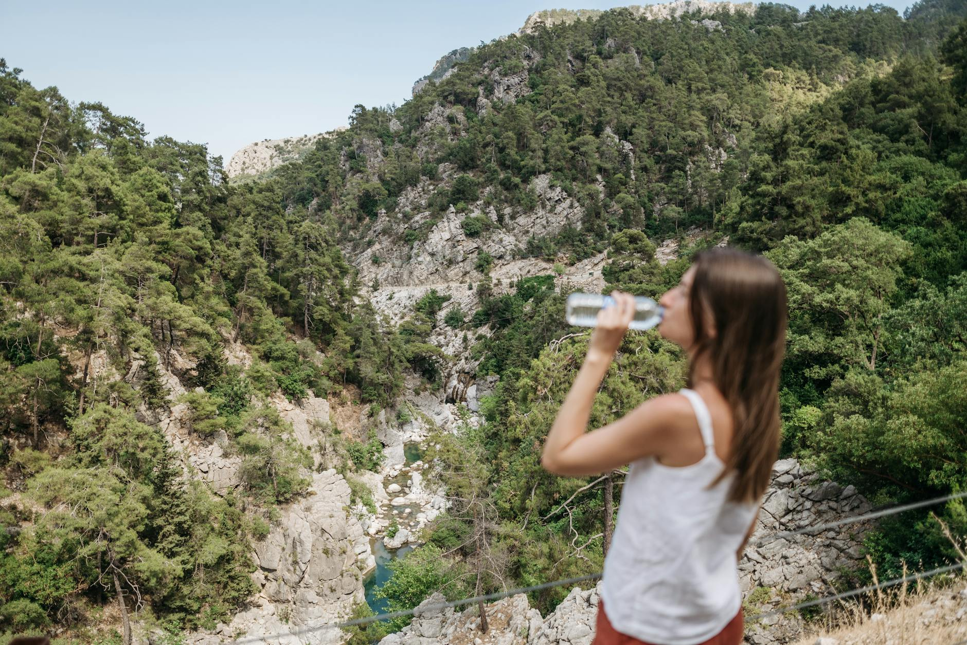 woman drinking best hiking water bottle